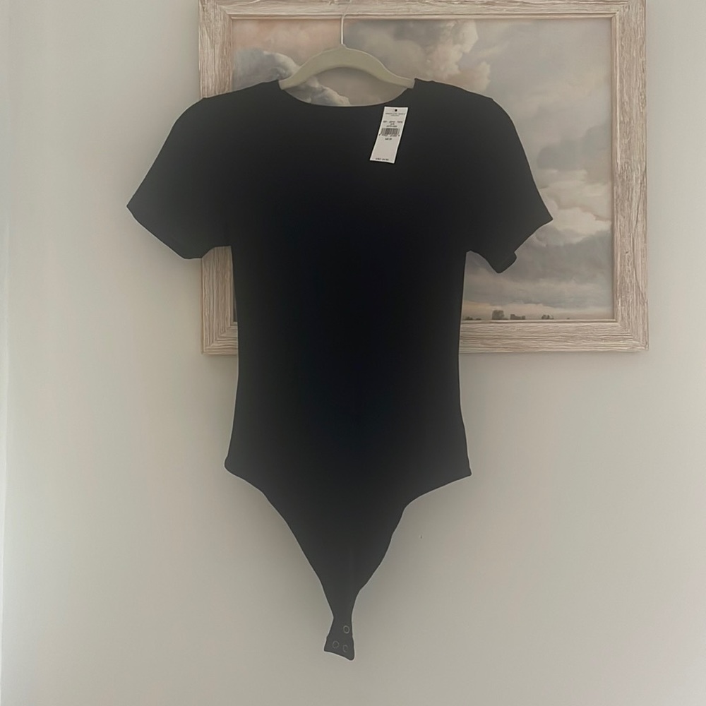 NWT black short sleeve ribbed body suit with snap closure